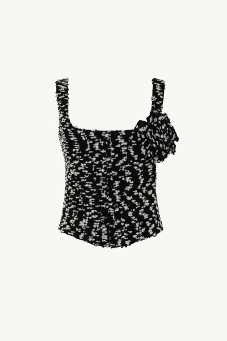 BLACK AND WHITE BOUCLÉ BUSTIER WITH FLORAL PIN